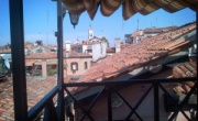 Private aperitif on a terrace overlooking the rooftops of Venice